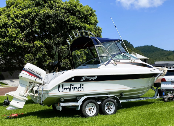 Rear three-quarter view with Johnson 130